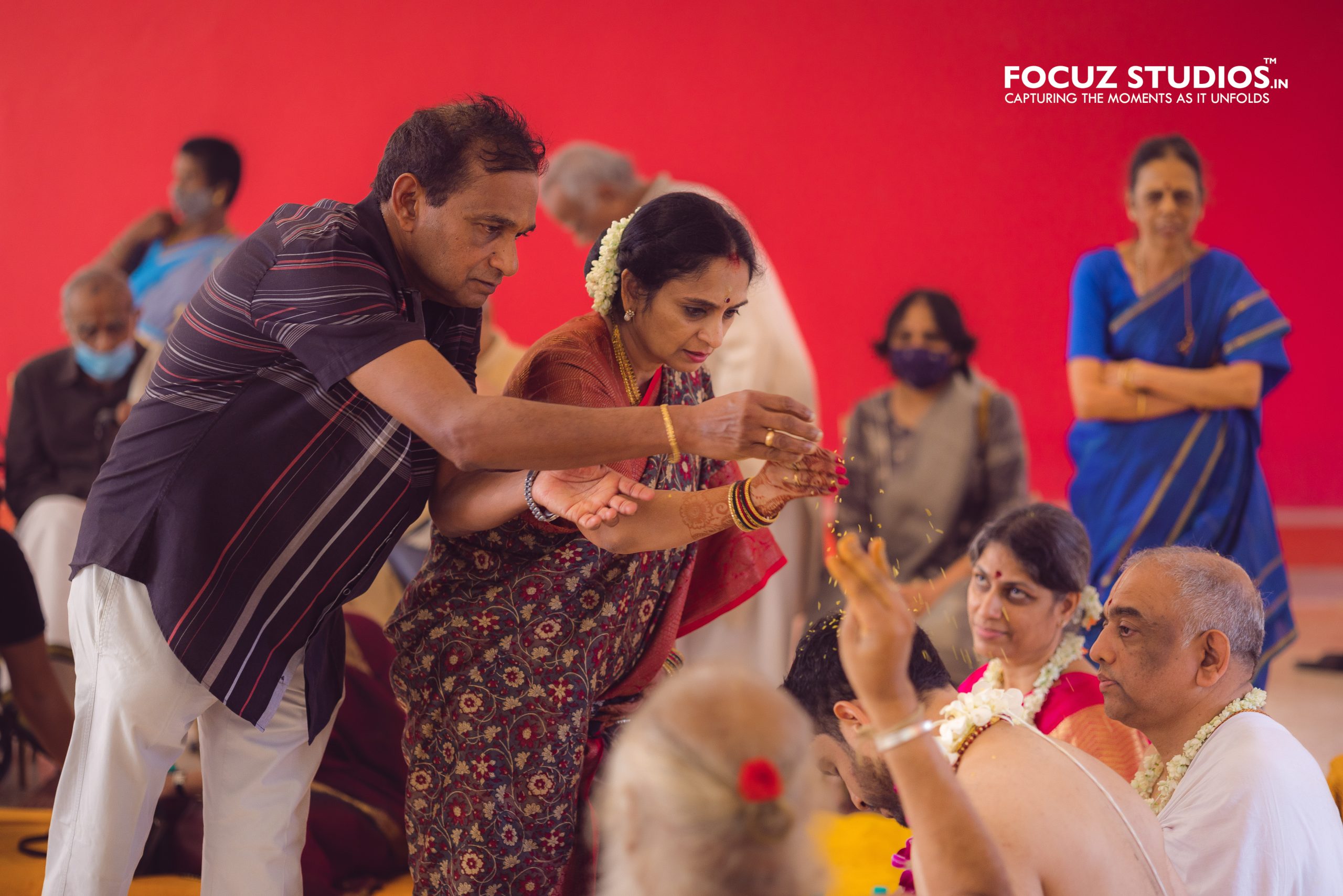 Parents participating in the traditional blessing ceremony