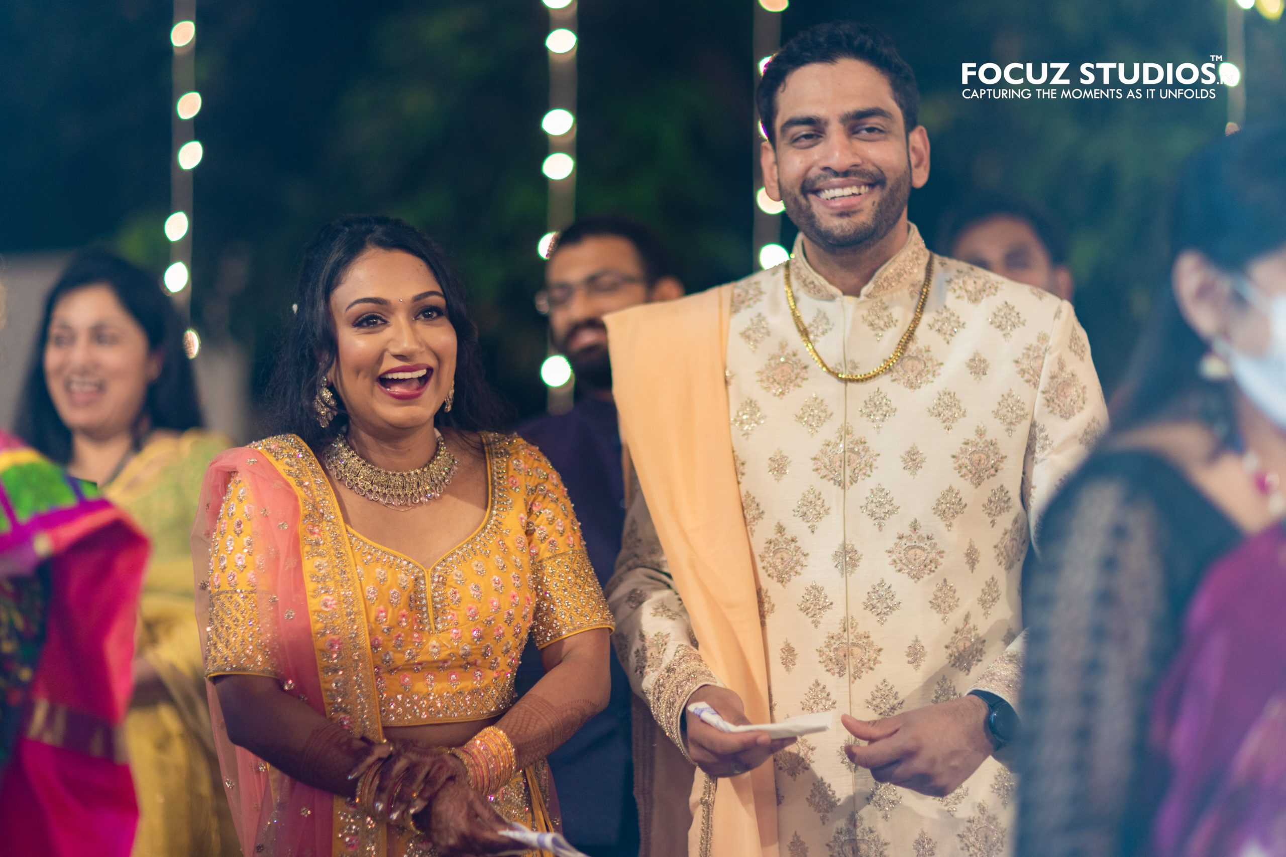 Nikita and Pranav sharing a joyful Sangeet moment