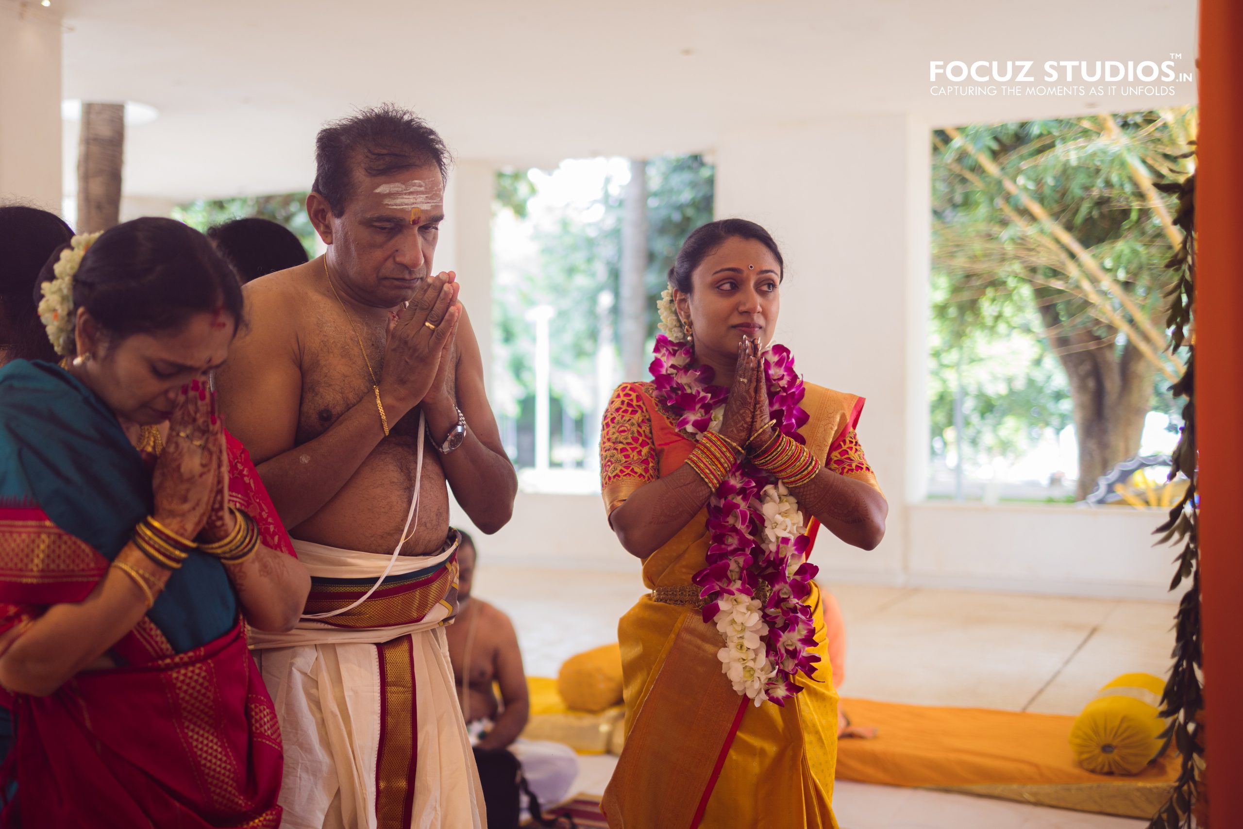 Bride praying during a sacred ritual