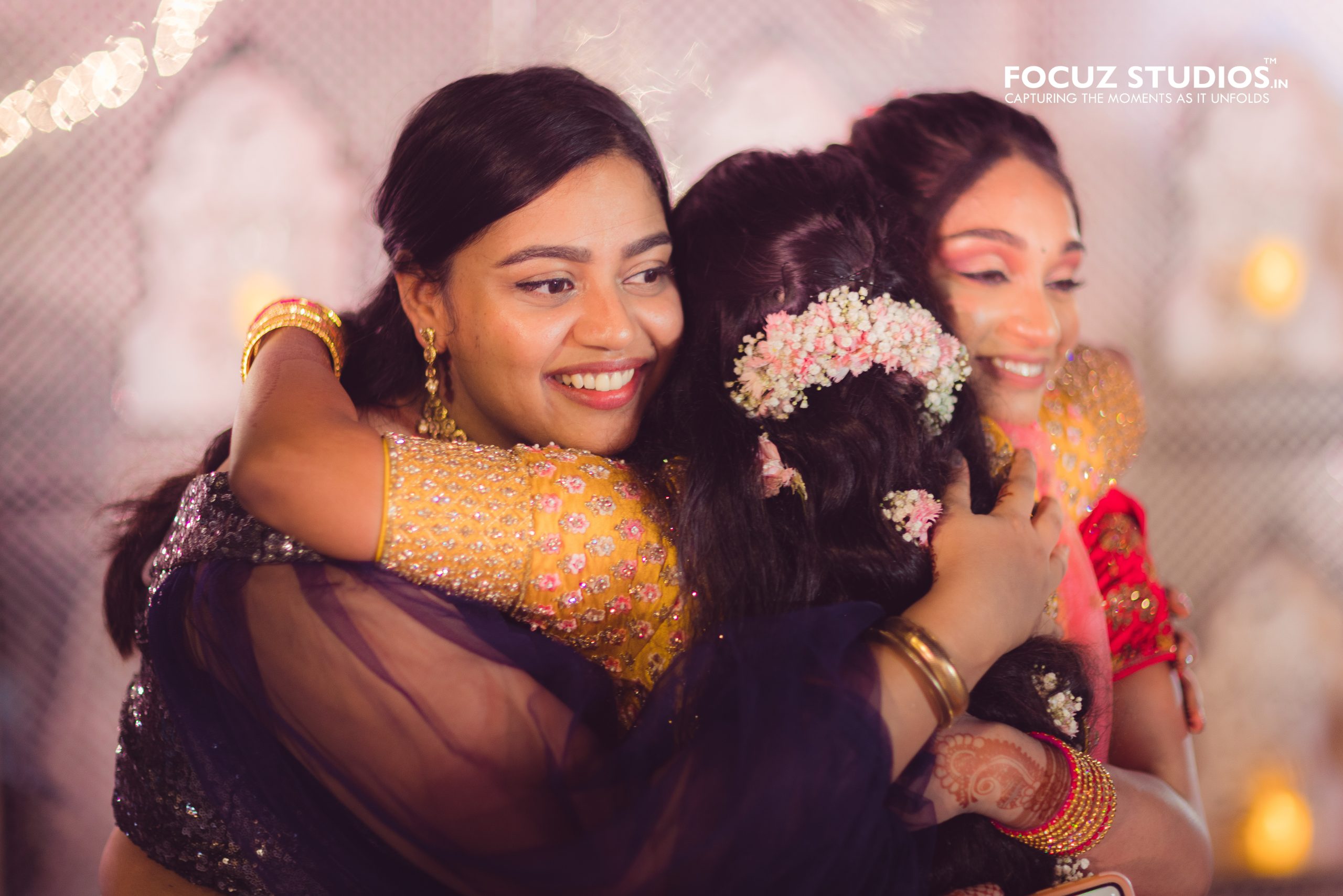 Candid family hug during Chennai Sangeet celebration