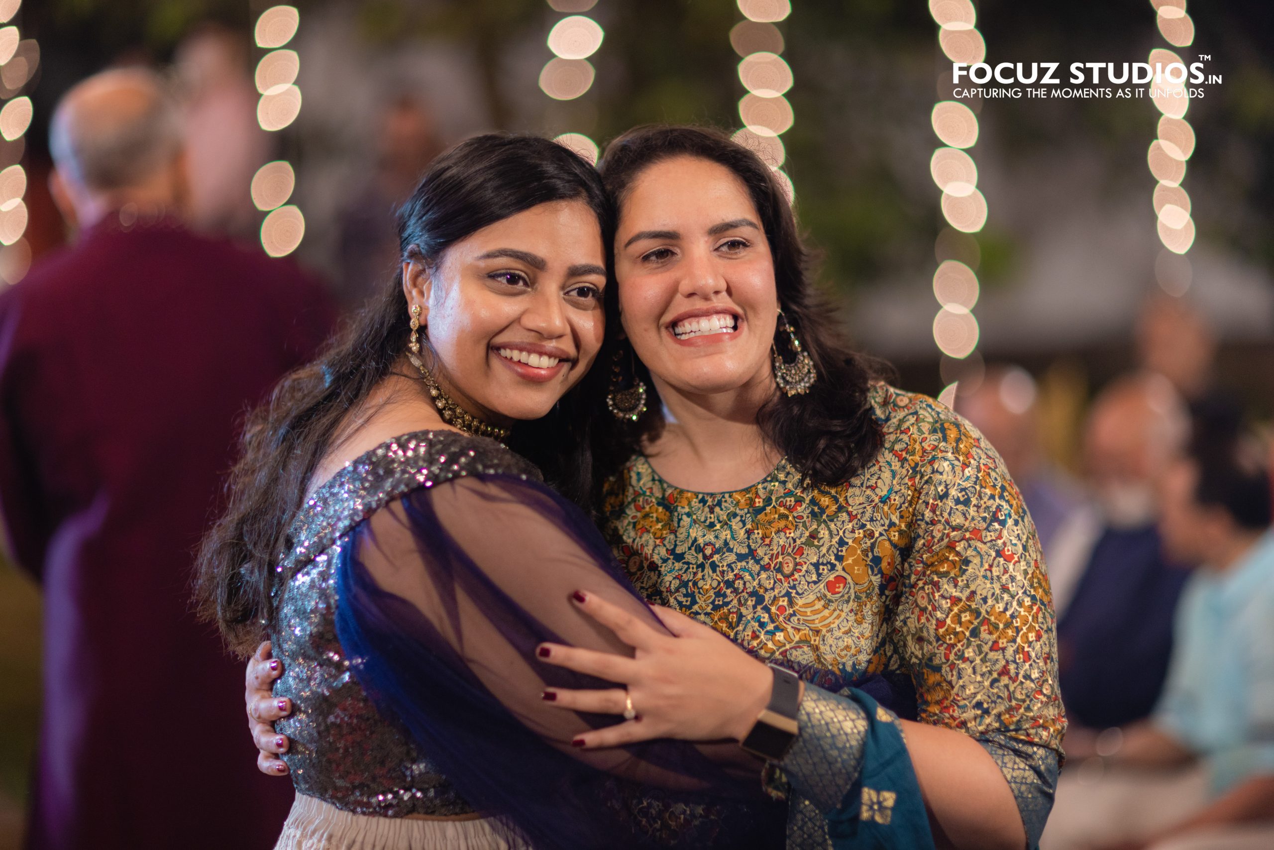 Friends sharing candid moment during Sangeet