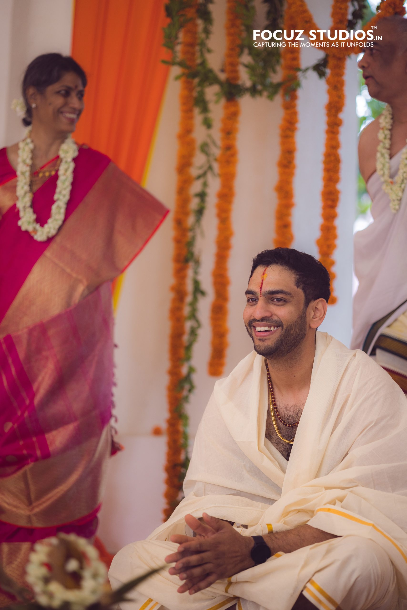 Smiling groom during the family ceremony