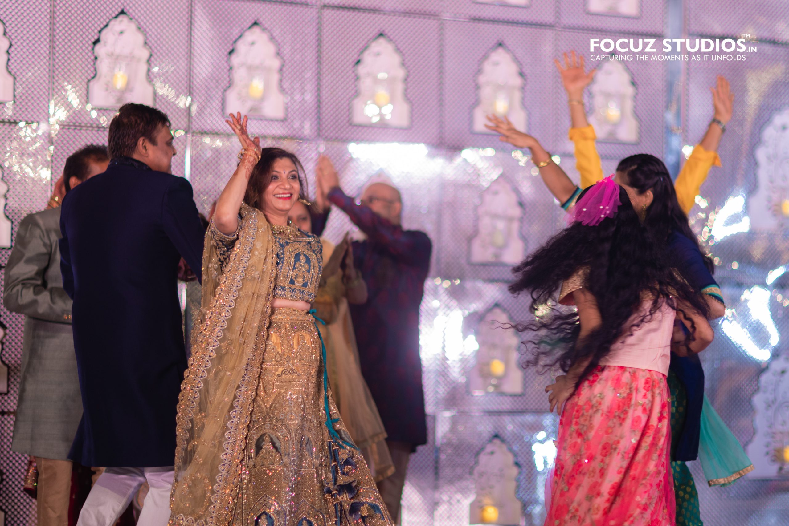 Family members performing together during Sangeet