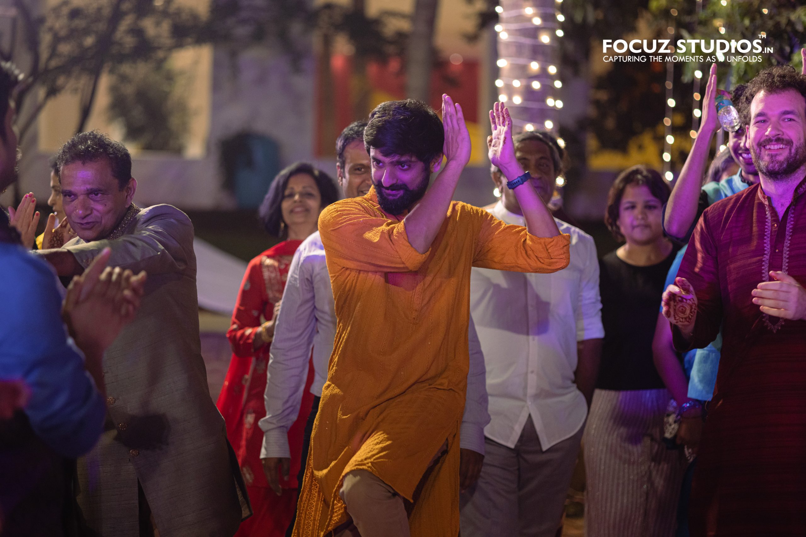 Energetic dance performance during Sangeet photography Chennai