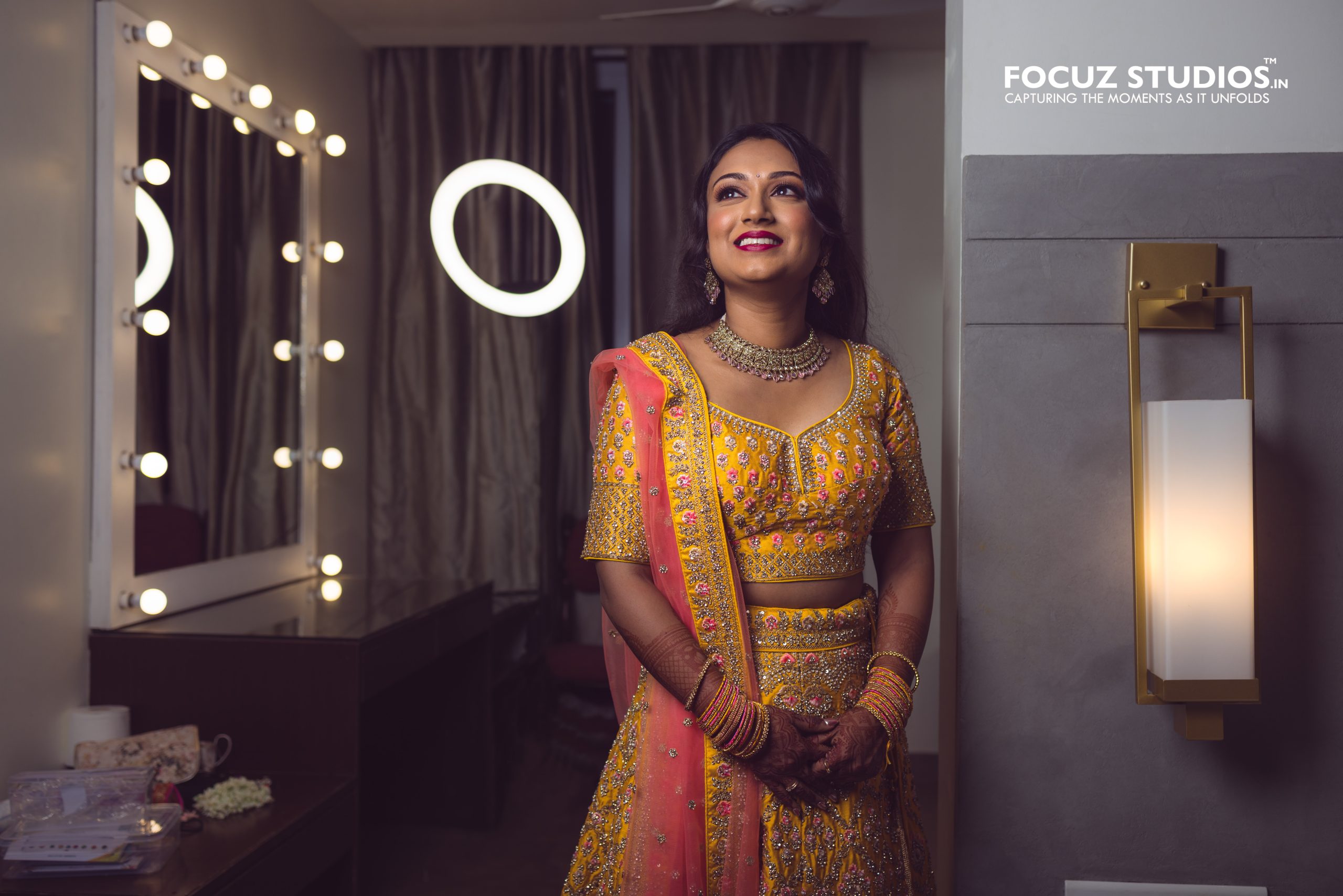 Nikita bridal portrait beside illuminated mirror